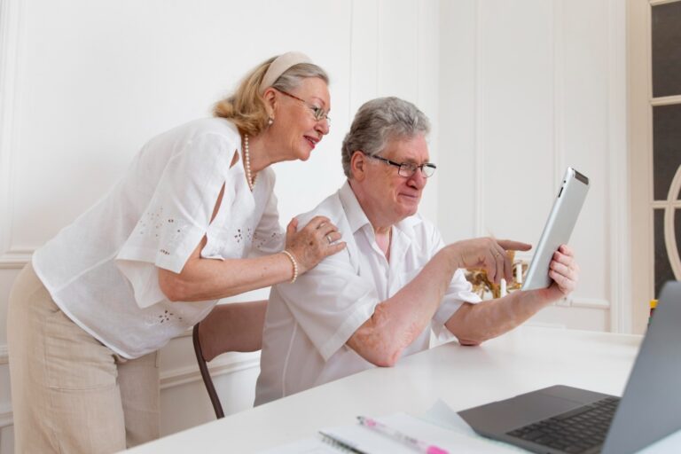 A couple reading a tablet